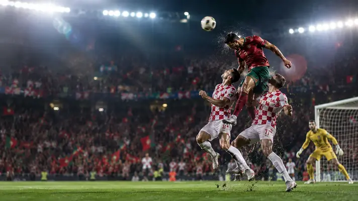 Croatia vs Portugal World Cup 2026 match action as a striker heads a late winning goal in a packed night stadium